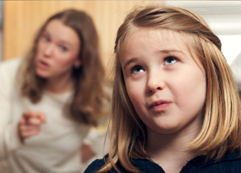 child-rolling-eyes-at-parent