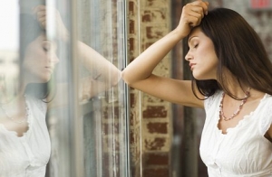 Woman Staring Out Window