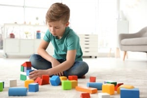 autism child playing with blocks