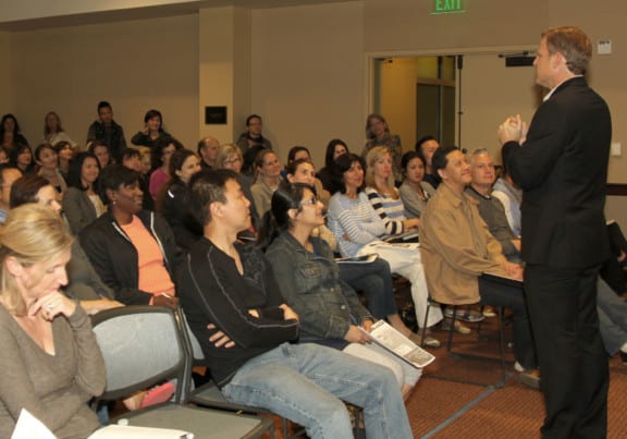 Jim West speaks to counselors, teachers and parents at school seminar