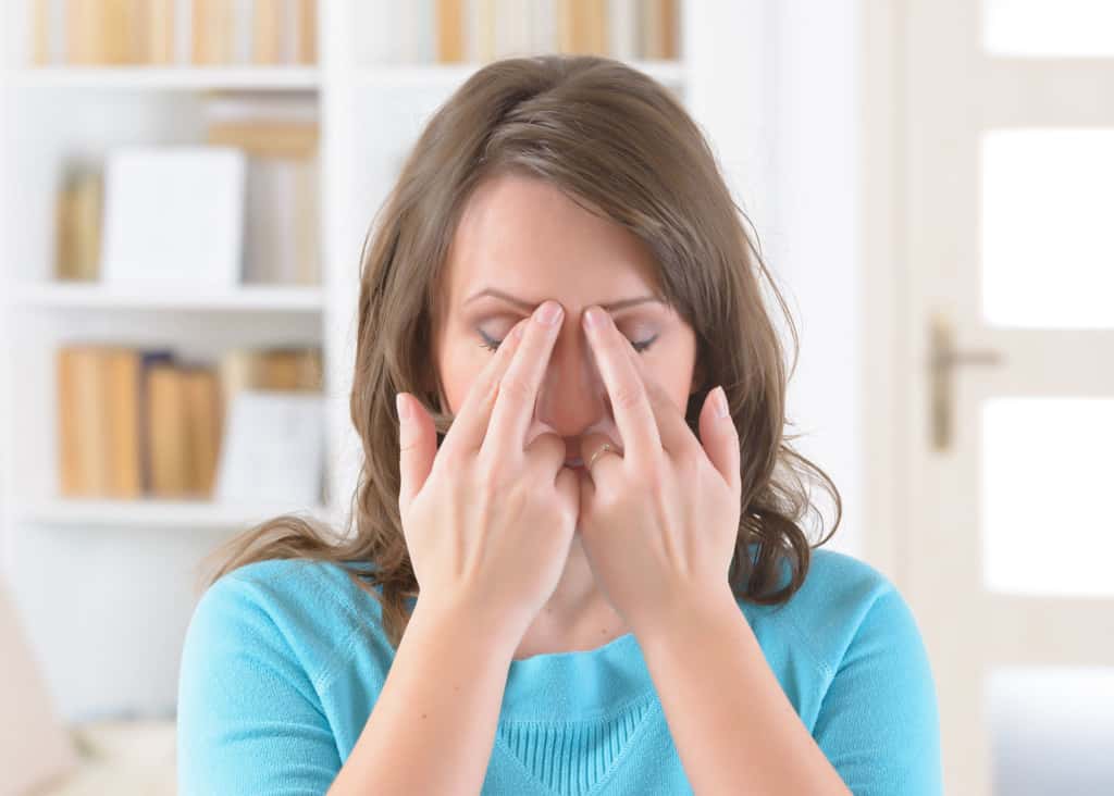 Woman demonstrating EFT tapping points