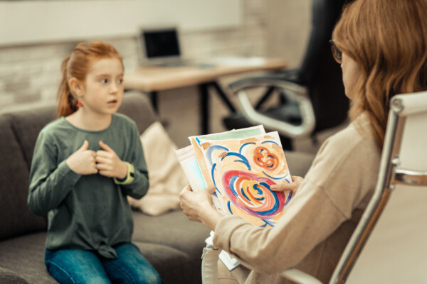 Female Play therapist helping a little girl with with Autism at Total Life Counseling Center Clermont
