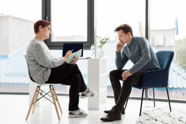 Long shot of patient and psychologist Long shot of patient and psychologist