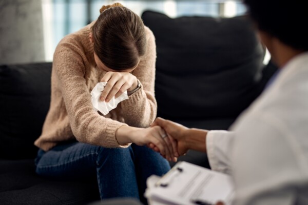 Therapist comforting a distressed woman 1 Therapist comforting a distressed woman