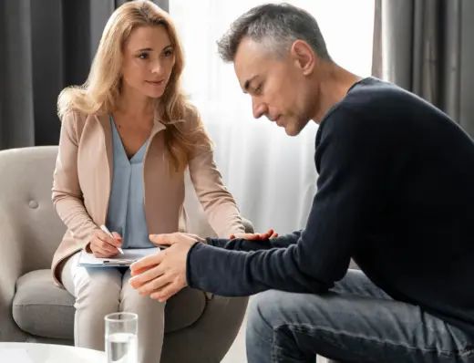 Psychologist comforting her client