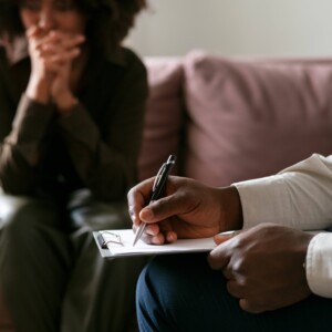 A woman sharing feelings and emotions during PPD therapy session