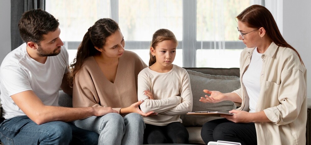 A counselor working with a family to resolve their conflicts.