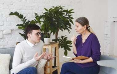 Adult speaking with a mental health professional during a counseling session, representing ADHD assessment, diagnosis, and support for individuals exploring how ADHD may be influenced by genetics and family history. - Total Life Counseling for Children, Teens, Adolescents and Adults in Orlando Winter Park Clermont Lake Mary and Central Florida Adult speaking with a mental health professional during a counseling session, representing ADHD assessment, diagnosis, and support for individuals exploring how ADHD may be influenced by genetics and family history.