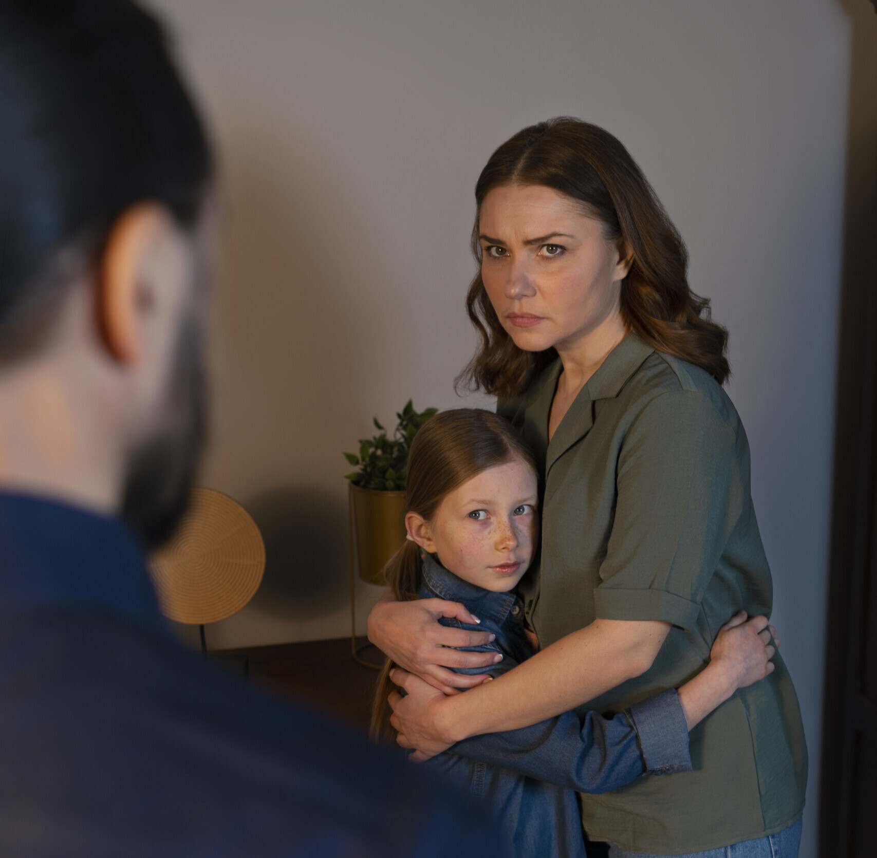 Child hugging her mother in fear Child hugging her mother in fear