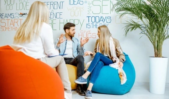Couple having an open discussion with a counselor during therapy session in Lake Mary Florida at Total Life counseling center