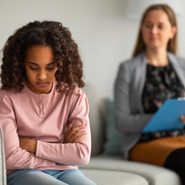 Psychologist assessing a teen girl Psychologist assessing a teen girl