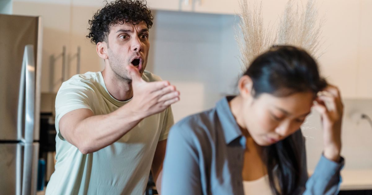Man screaming at a woman in anger Man screaming at a woman in anger