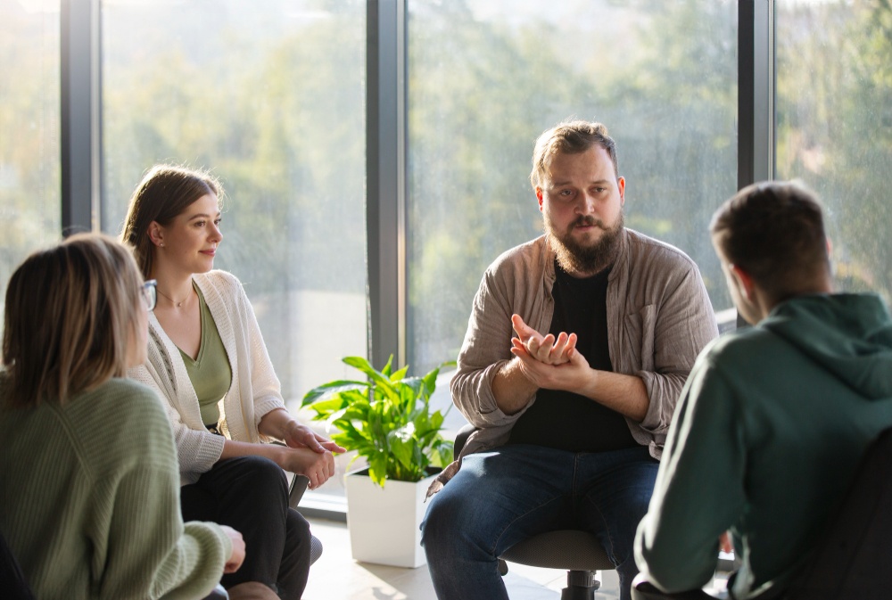 A family attending a group therapy session