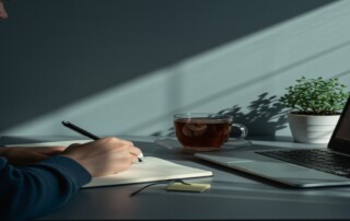 Person reflecting on mental health goals for 2026 with calming, minimalist background.