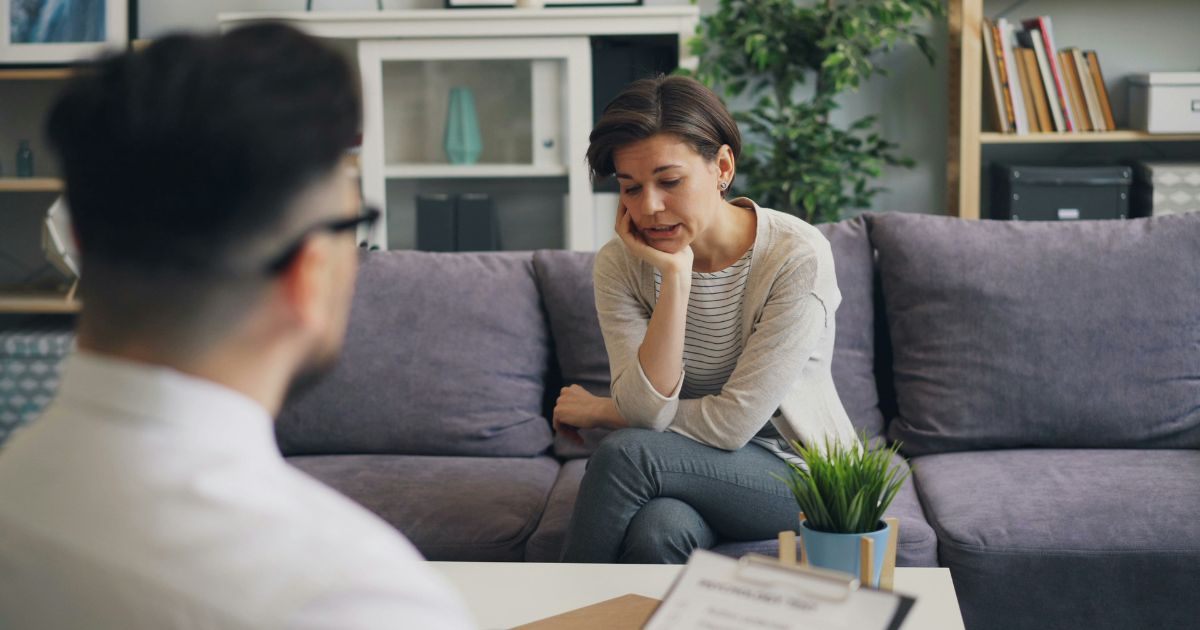 Young lady sharing her problems with a therapist Young lady sharing her problems with a therapist