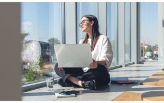 young woman with laptop window summer morning (1)