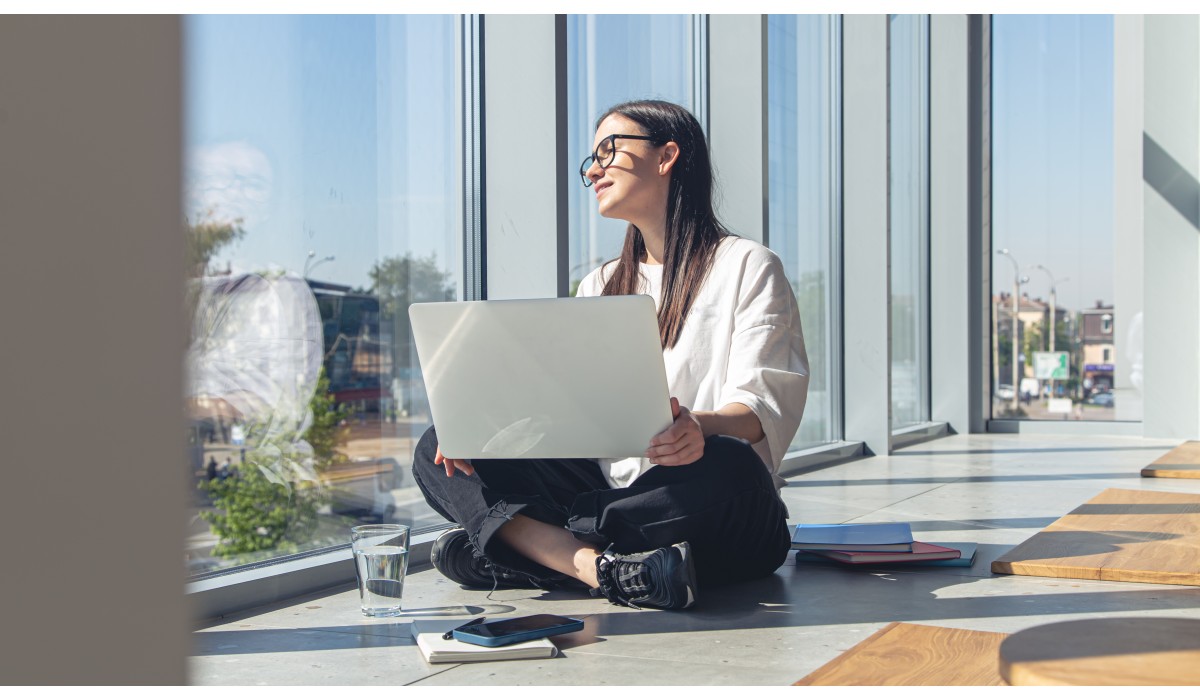 young woman with laptop window summer morning (1)