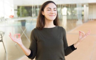 Woman standing and meditating