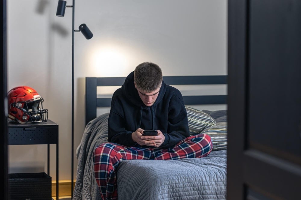 Teenager using smart phone