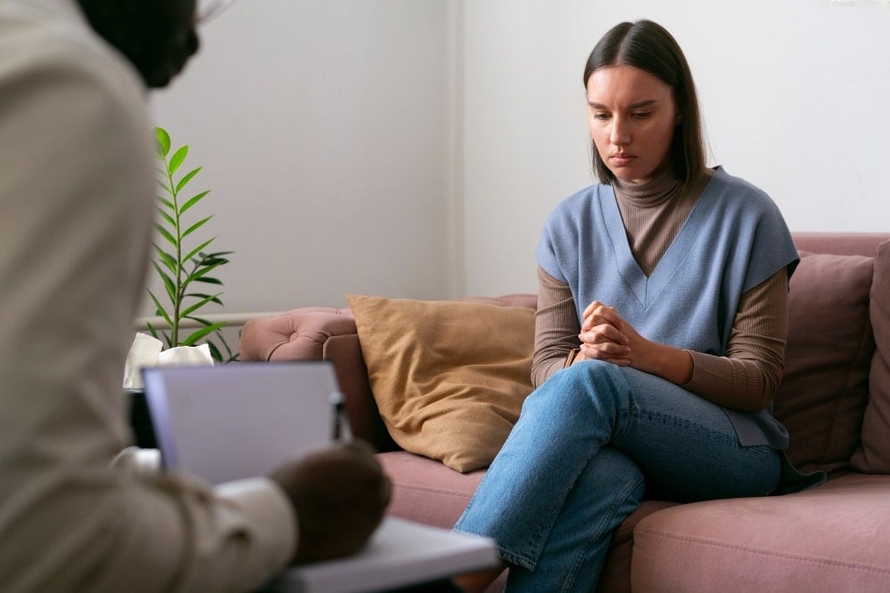 Person sharing feelings and emotions during therapy session - Total Life Counseling for Children, Teens, Adolescents and Adults in Orlando Winter Park Clermont Lake Mary and Central Florida Person sharing feelings and emotions during therapy session