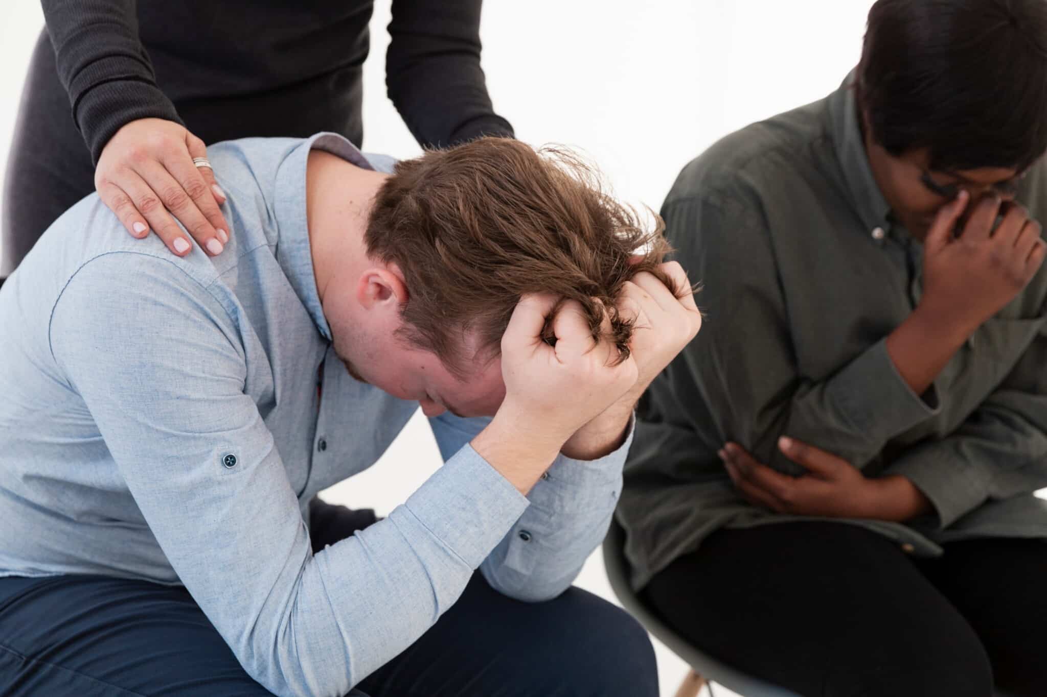 Female hands consoling sad male patient - Total Life Counseling for Children, Teens, Adolescents and Adults in Orlando Winter Park Clermont Lake Mary and Central Florida Female hands consoling sad male patient